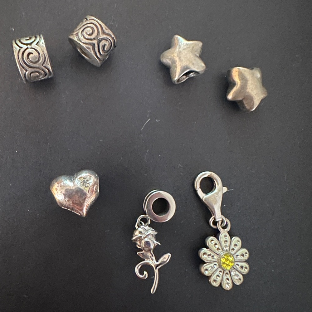 Silver Charm Lot of 7 featuring Disney Rose, Daisy, spacer stars, and more